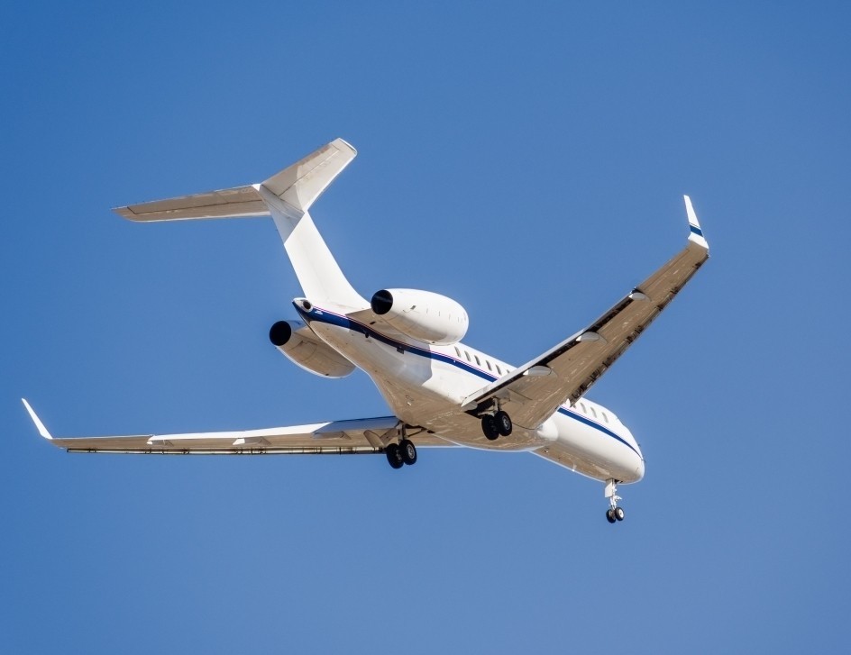 Private jet flying overhead