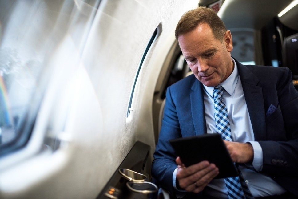 An executive at work aboard his business jet