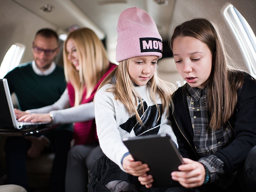 A family using a charted jets cabin electronics