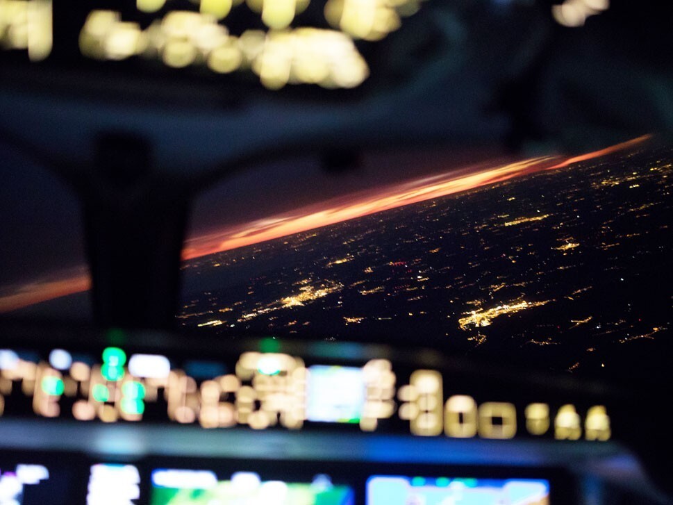 Blurred-out lights from airplane flight deck at night