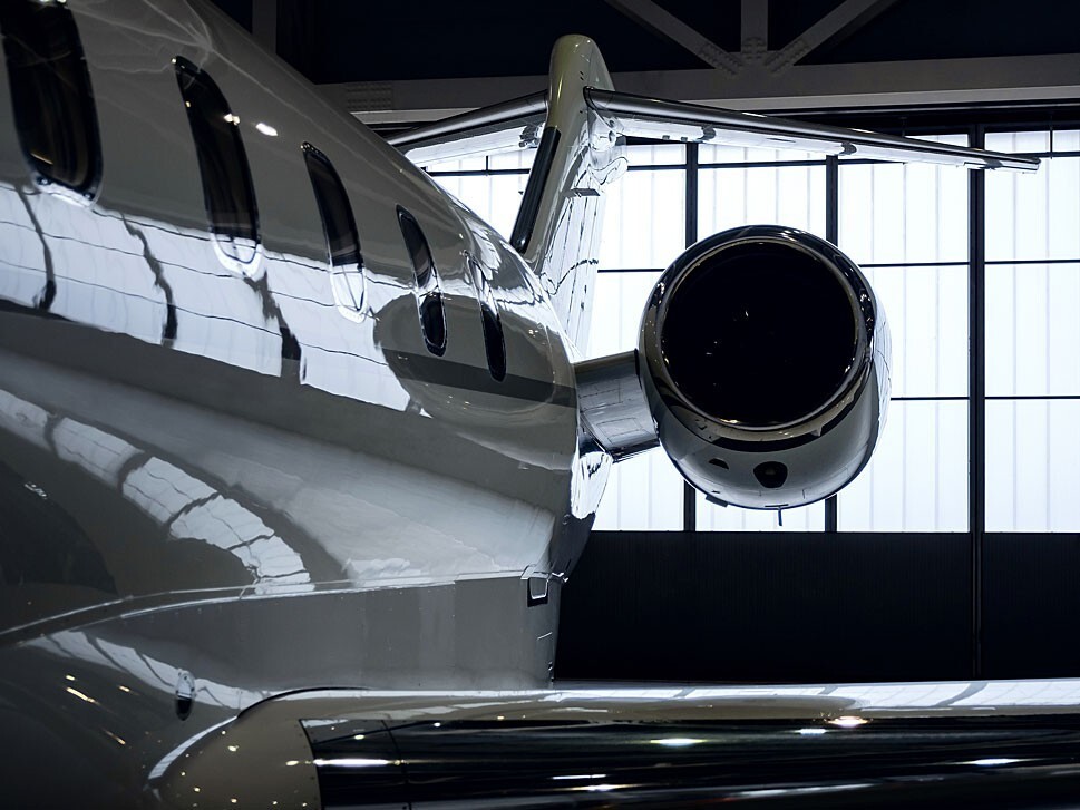 Private jet parked in a hangar