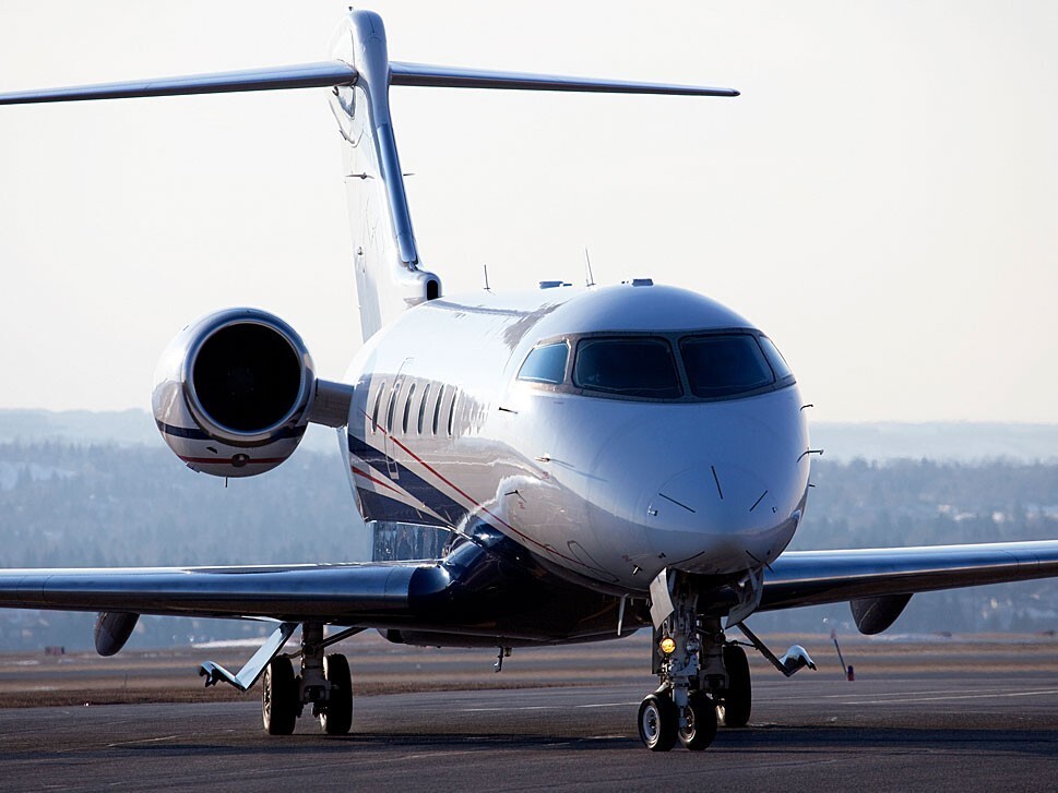Private jet taxis across an airport apron
