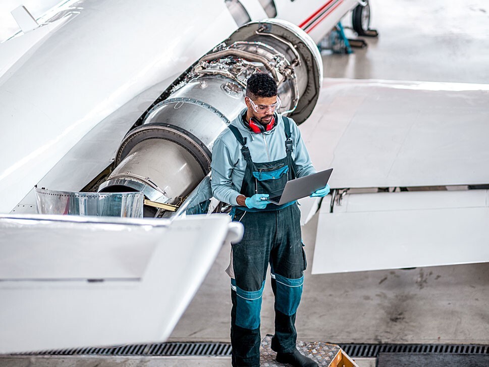 Private jet mechanic checks airplanes electronic logbooks