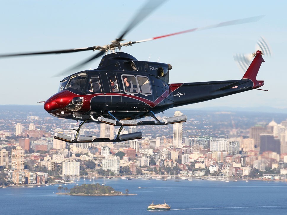 Bell 412EP in flight near a city business district